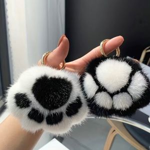 fluffy paw keychain/bag charm.Pick your color 1 white, 2 black, 2 pink available